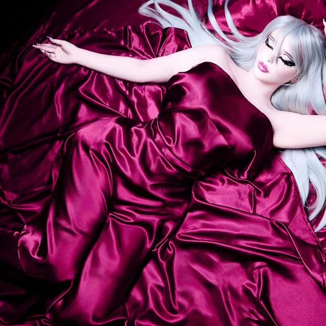PROTAGONIST album cover — figure in magenta satin with silver hair